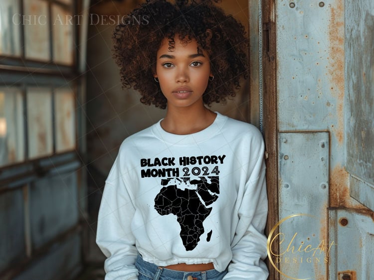 Black woman wearing black history month 2024 African Continent PNG design on white sweatshirt