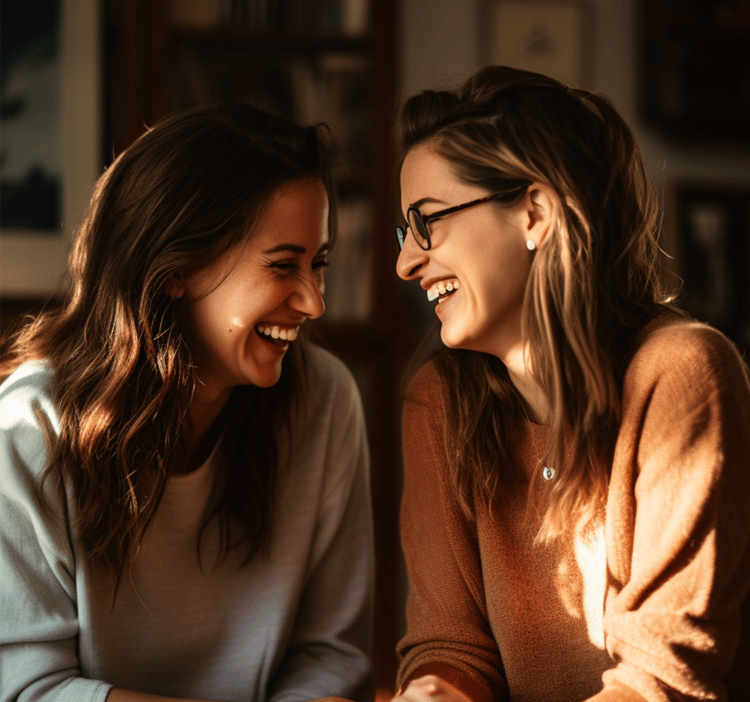 two women laughing together