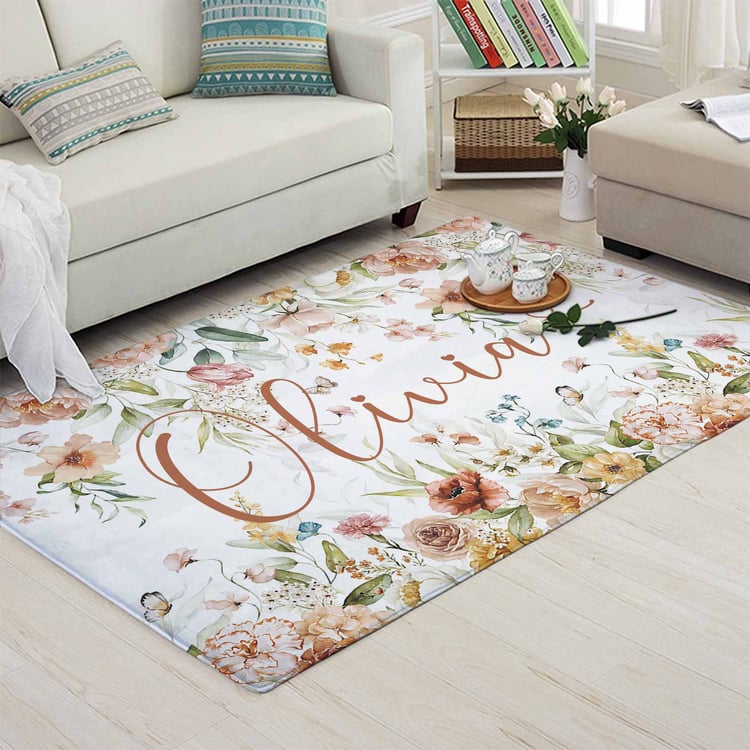 A beautiful floral custom name rug, perfect for your living room decor. Add a personal touch to your space with this lovely rug!