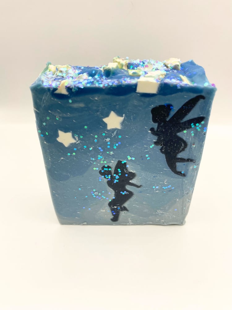 Blue soap bar with fairies silhouetted in the twilight sky surrounded by stars