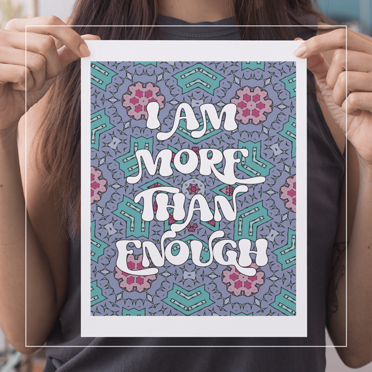 girl holding coloring page with affirmation