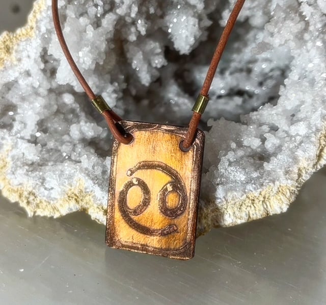 copper horoscope pendant