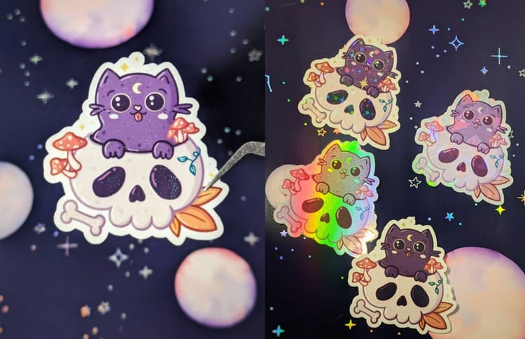 Sticker of a cute purple cat with a crescent moon on its forehead, playfully perched atop a whimsical skull