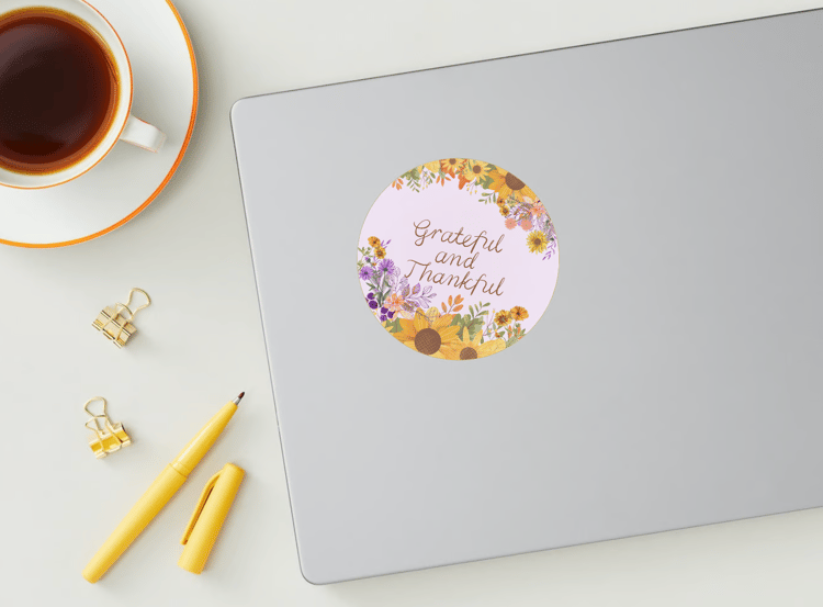 Customizable Vibrant Floral Abundance Circle Sticker | Digital Canva Template. Mock sticker on laptop