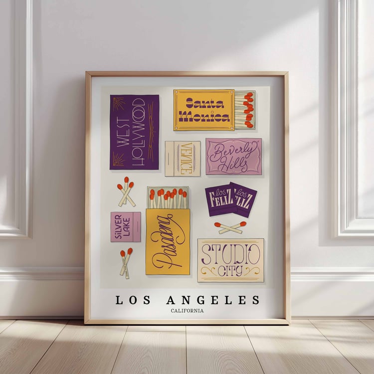 A framed picture of Los Angeles, California neighborhoods drawn in various lettering styles on matchboxes. Artwork has a purple and yellow color scheme