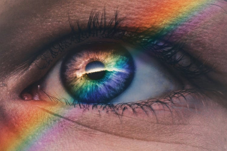 Eye with a rainbow lighting along it