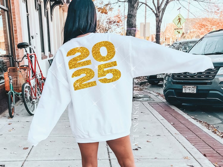 woman wearing white sweatshirt with gold glitter 2025 sublimation design