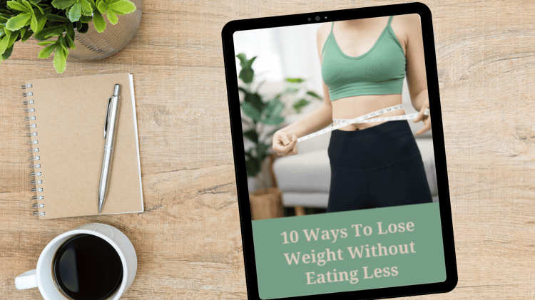 A woman in a green sports bra and black leggings measures her waist with a tape measure. The text "10 Ways to Lose Weight Without Eating Less" is displayed on a beige background at the bottom of the image. A cozy living space with plants and a sofa is vis