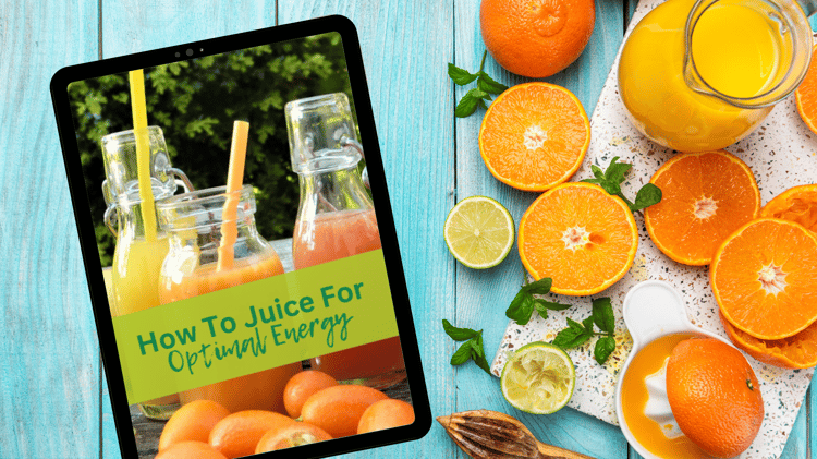 Three glass bottles filled with fresh orange, yellow, and red juices sit on an outdoor table, with vibrant oranges in the foreground. A green banner with the text "How to Juice for Optimal Energy" overlays the image, promoting a juicing guide for boosting