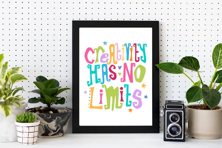 A downloadable print with a hand lettered design which says ‘creativity has no limits’ in a range of bright colours.