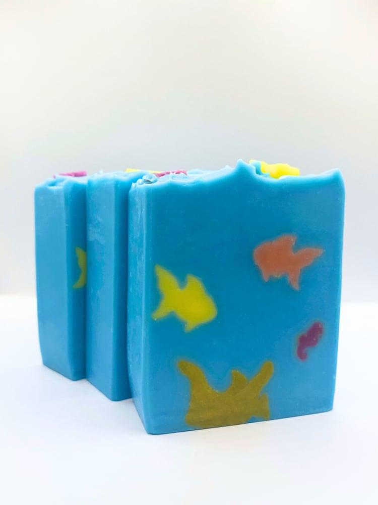 Coral reef handmade artisan soap depicts an underwater scene with coral, fish, and seahorse