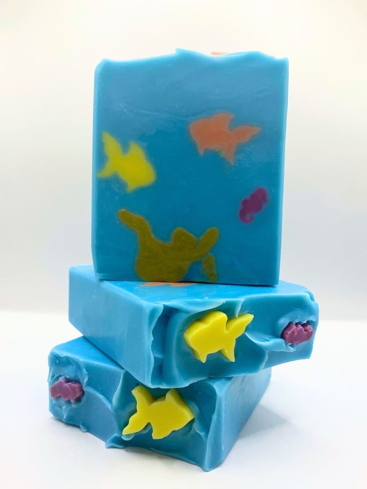 Coral reef handmade artisan soap depicts an underwater scene with coral, fish, and seahorse