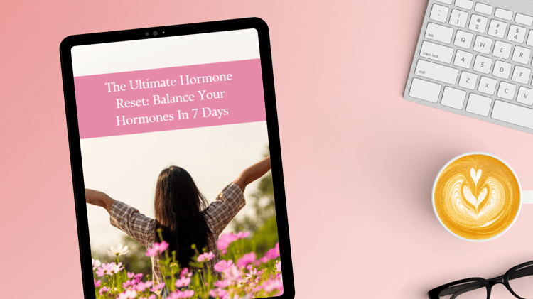 A woman with long dark hair stands in a field of pink and yellow flowers, arms outstretched toward the sun, symbolizing balance and well-being. The text "The Ultimate Hormone Reset: Balance Your Hormones in 7 Days" overlays the image, promoting a health g