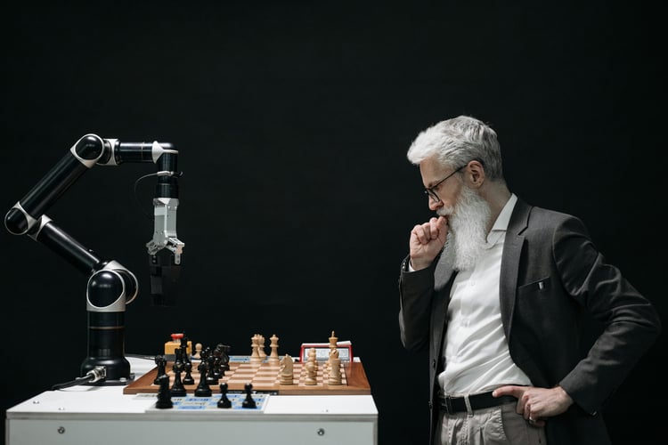 Robot plays chess with a human