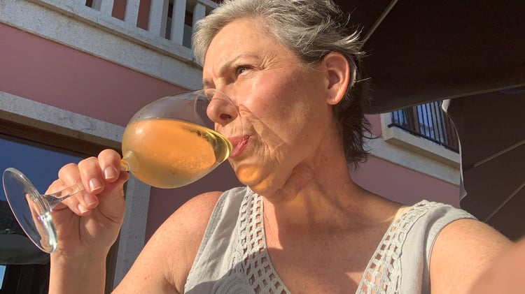 Woman drinking wine after radiation