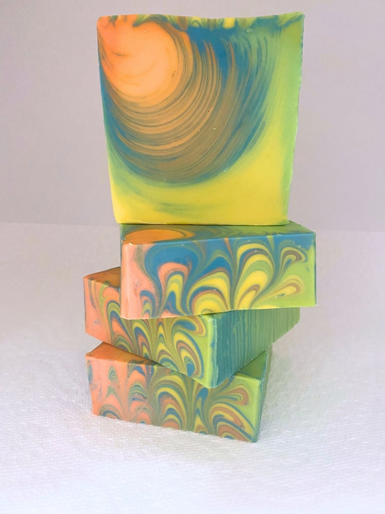 Surfing the Tube handmade soap depicts an artistic wave swirl