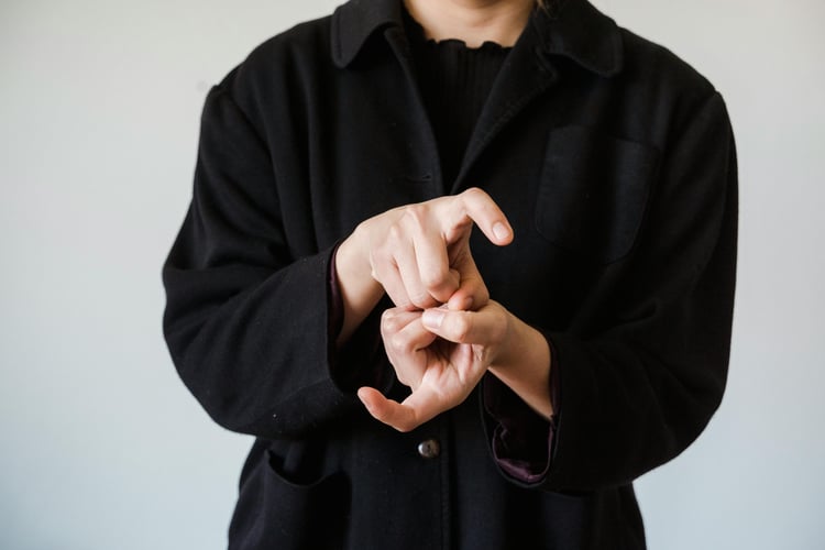 A person using Sign Language to communicate