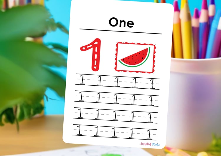 number-flashcards-1-4-handwriting-practice on a flashcard on a desk with pencils