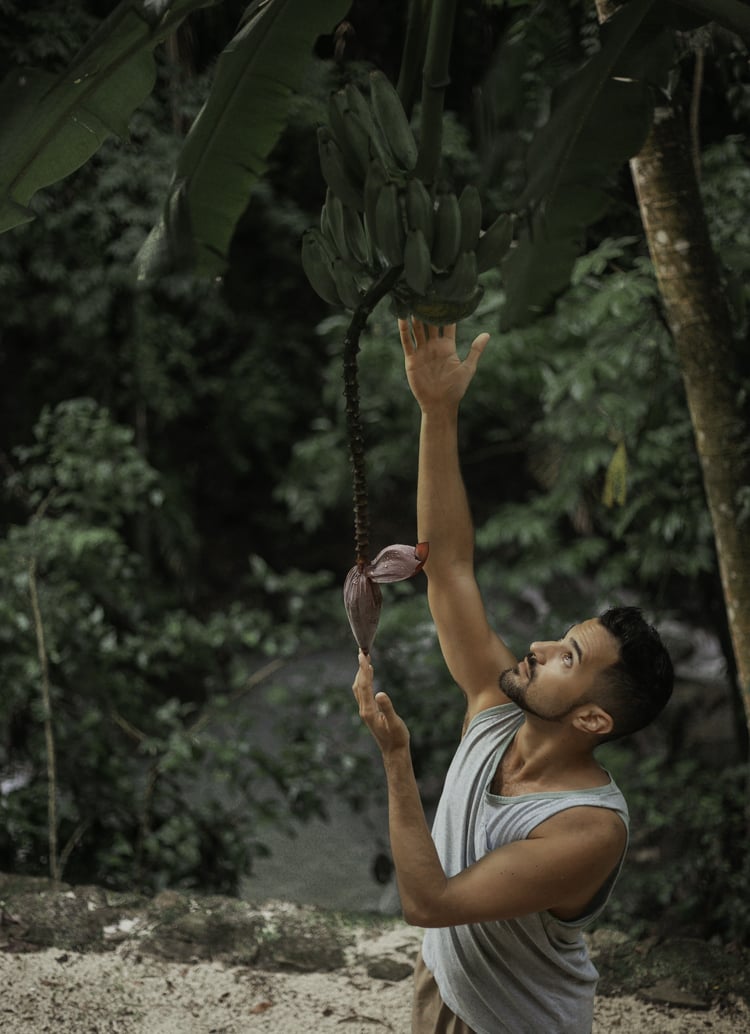 Yoga teacher Tristan connecting fruit and flower
