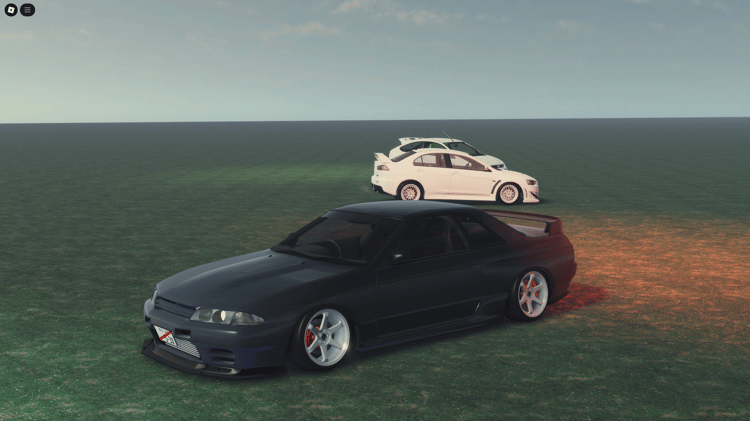 Three customized cars lined up on an open field, ready for action.