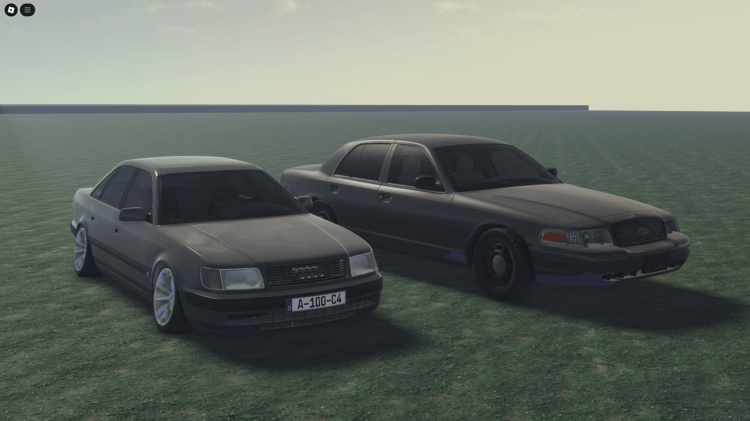 Two simple gray cars parked side by side, perfect for minimalist games.
