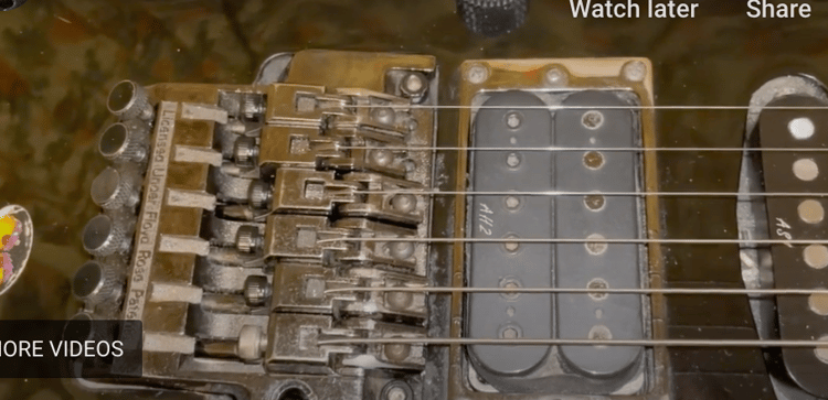 Strings on an electric guitar floating bridge