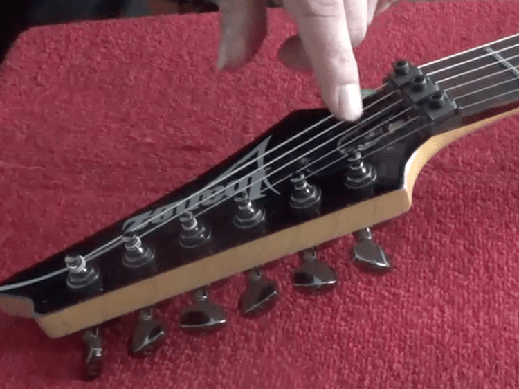 location of the truss rod on an electric guitar