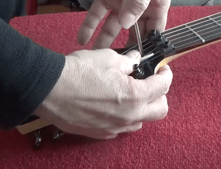 adjusting the truss roc on an electric guitar