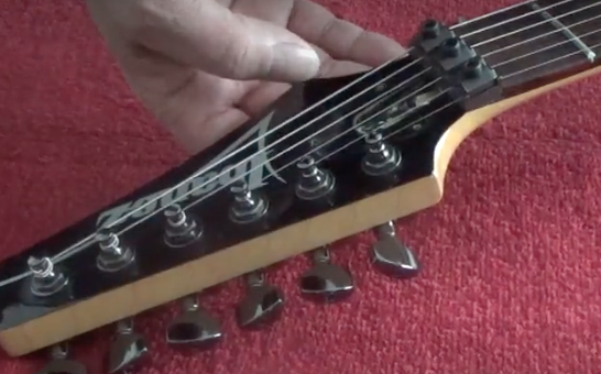 headstock of an Ibanez electric guitar