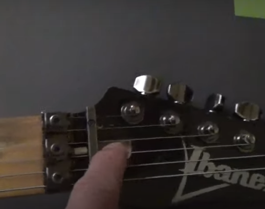 Electric guitar truss rod cover removed