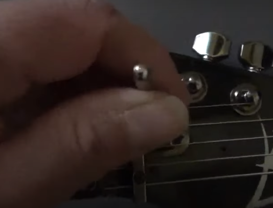Adjusting the truss rod on an electric guitar