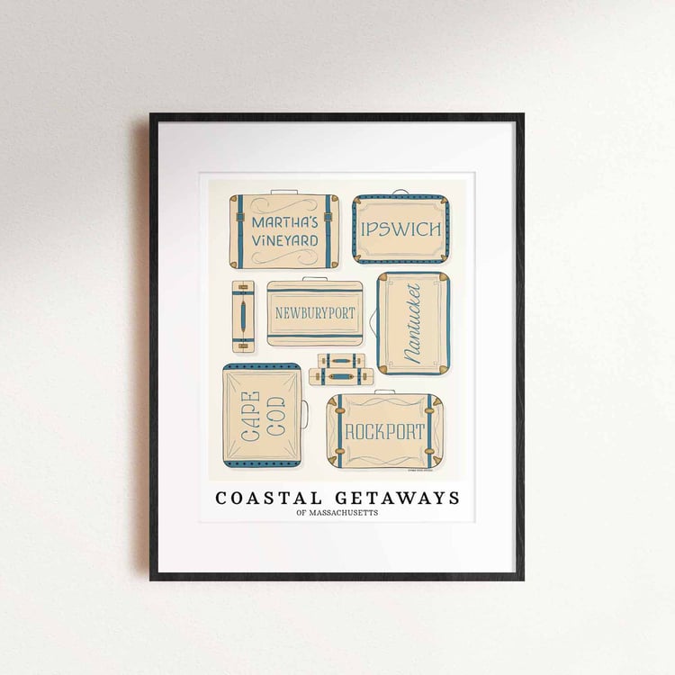 A framed picture of coastal Massachusetts areas drawn in various lettering styles on suitcases. Artwork has a beige and blue color scheme