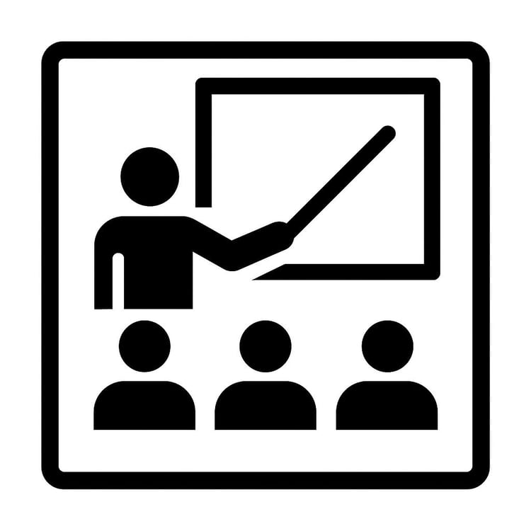 Instructor teaching a class with students and whiteboard icon