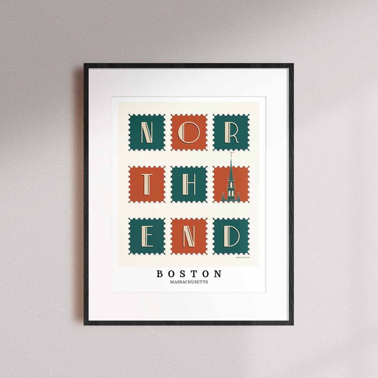 A framed picture of postage stamps featuring the North End neighborhood in Boston, Massachusetts drawn in a unique lettering style. Artwork has a orange, green and beige color scheme