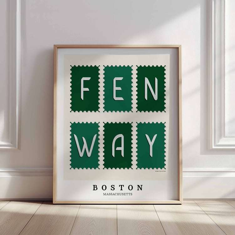 A framed picture of postage stamps featuring the Fenway neighborhood in Boston, Massachusetts drawn in a unique lettering style. Artwork has a green and white color scheme