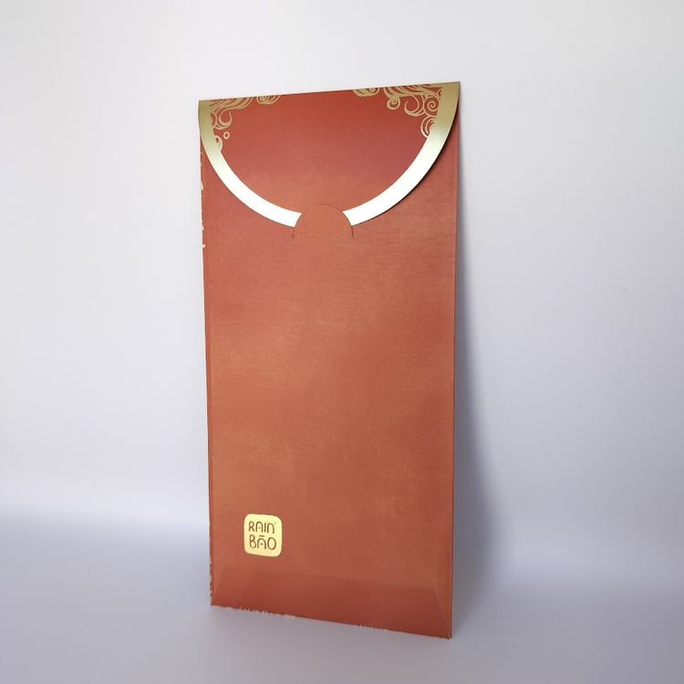 Back of a red hongbao with gold trim on the closing flap and a logo on the bottom left corner.