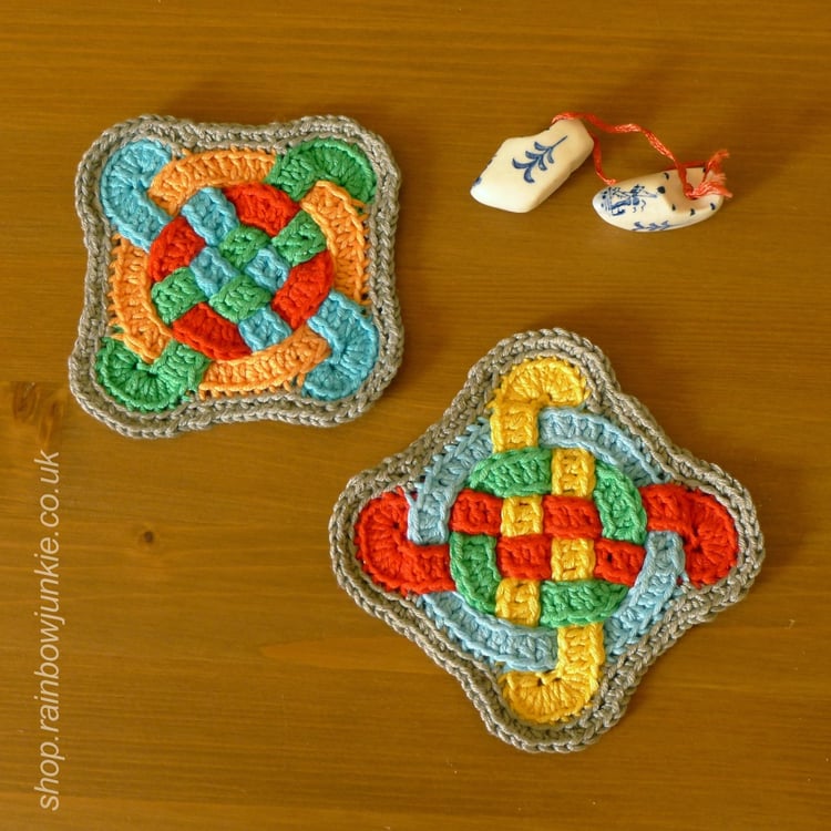 Two edged Celtic Coasters on table.