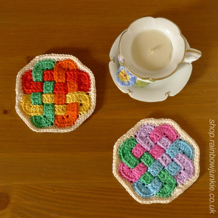 Two octagonal Celtic coaters on a table.