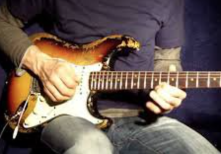 playing the electric guitar