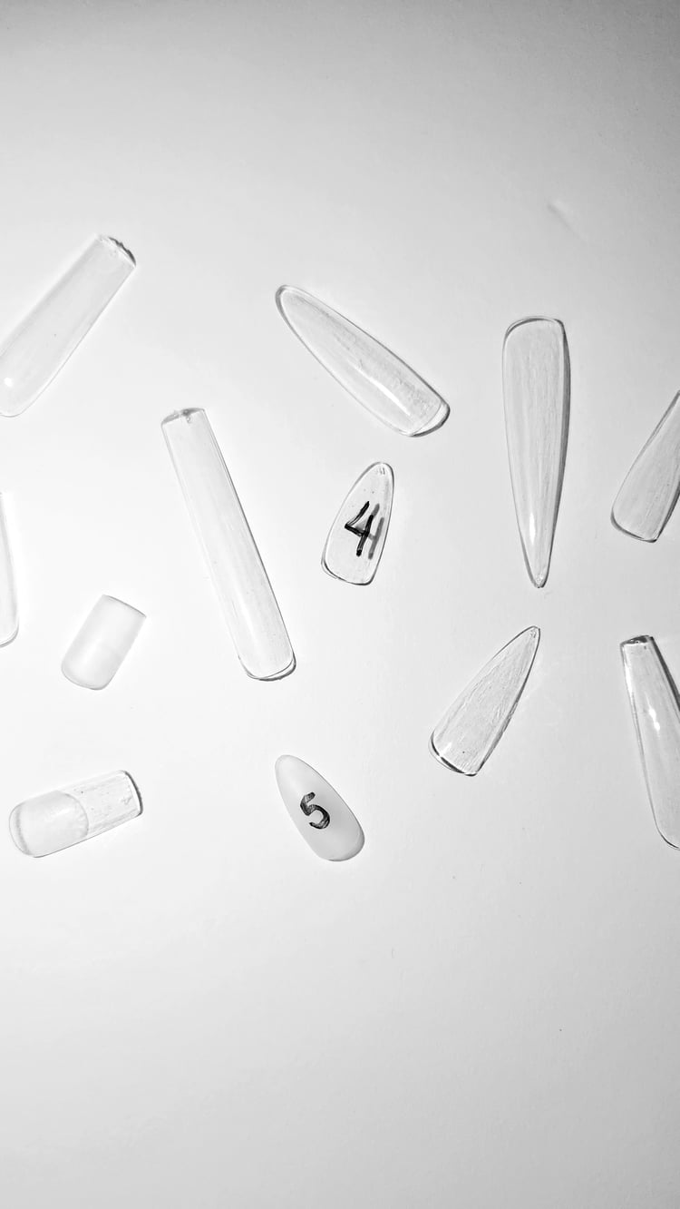 a picture of various press-on nail tips showing the different nail tip shapes and lengths available for purchase from Pressed By Talia Shop