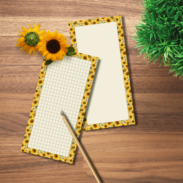 Close-up of sunflower border notepad with lined and grid page formats for printable journaling or planner use.