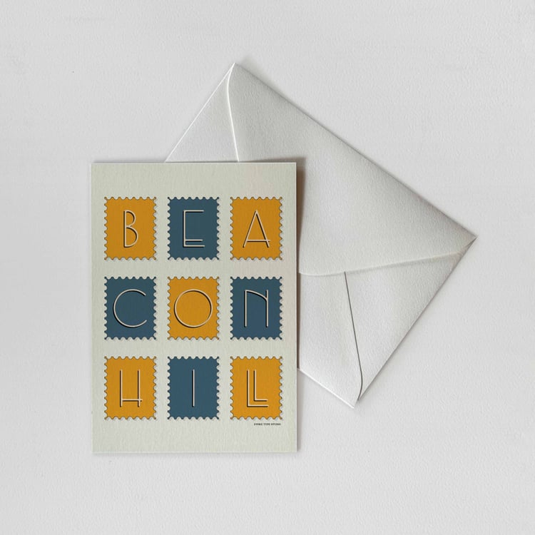 A notecard of postage stamps featuring the Beacon Hill neighborhood in Boston, Massachusetts drawn in a unique lettering style with a white envelope. Artwork has a blue and yellow color scheme