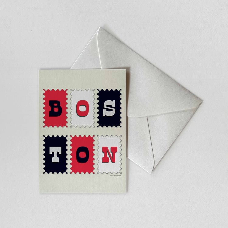 A notecard of postage stamps featuring Boston, Massachusetts drawn in a unique lettering style with a white envelope. Artwork has a patriotic color scheme of red, white and blue