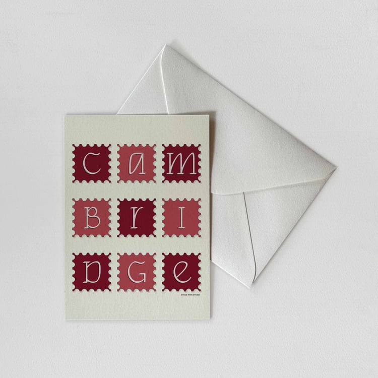 A notecard of postage stamps featuring Cambridge, Massachusetts drawn in a unique lettering style with a white envelope. Artwork has a red and white color scheme