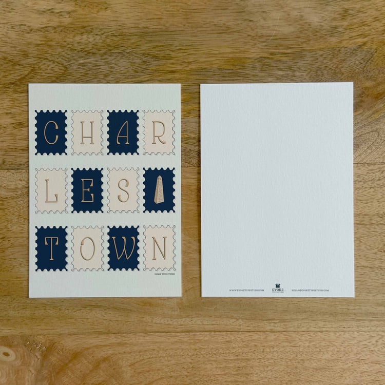 Two sides of a notecard, with postage stamp artwork on the front and a mostly blank back with company contact information at the bottom of the notecard.