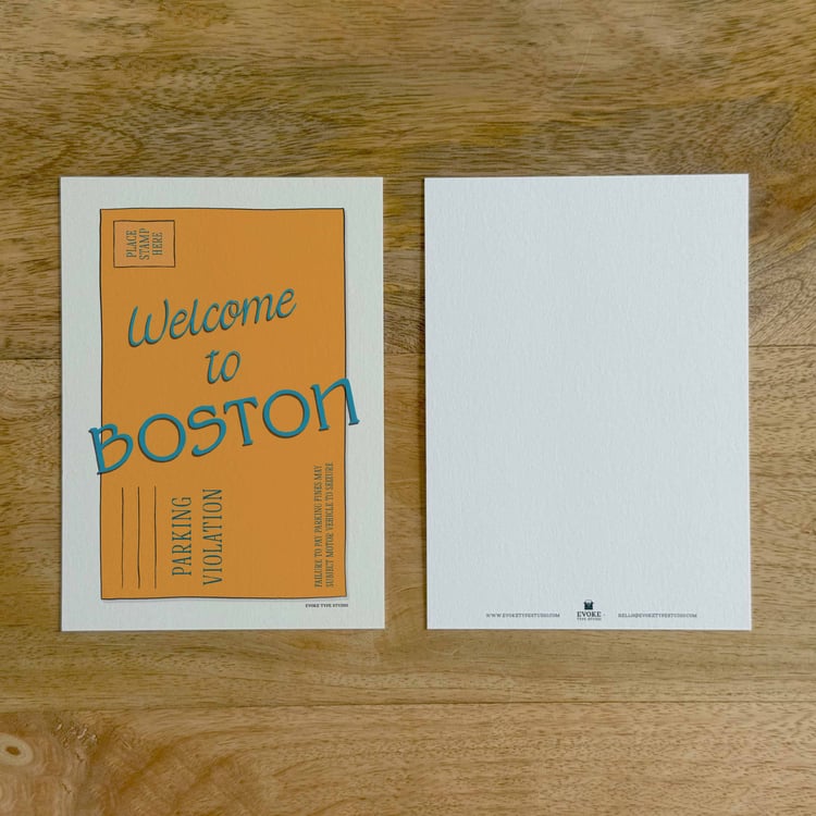 Two sides of a notecard, with postage stamp artwork on the front and a mostly blank back with company contact information at the bottom of the notecard.