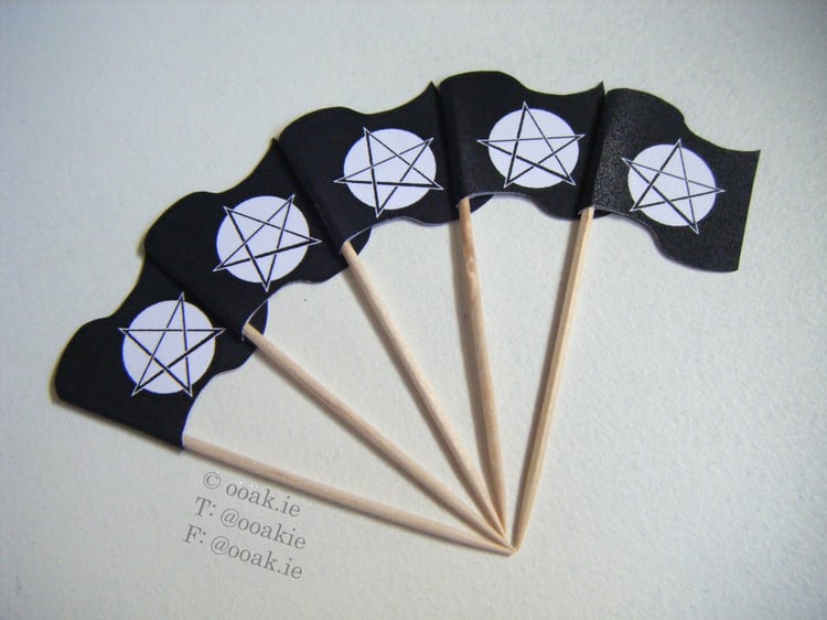 Printable sheet of mini Pentacle flags with a full moon background, shown as DIY gothic cupcake toppers.