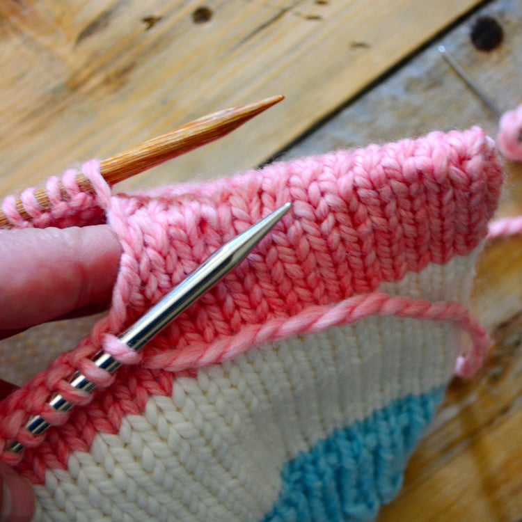 A circular swatch that is partially bound off using grafting, or Kitchener Stitch.