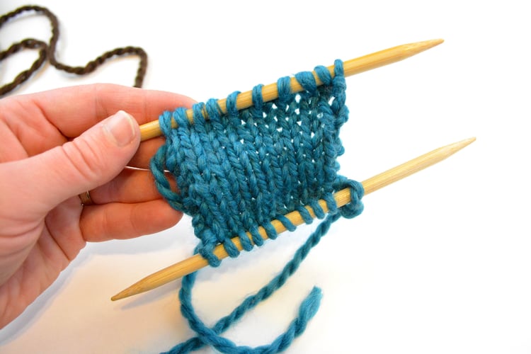 A swatch with live stitches on both the top and bottom.