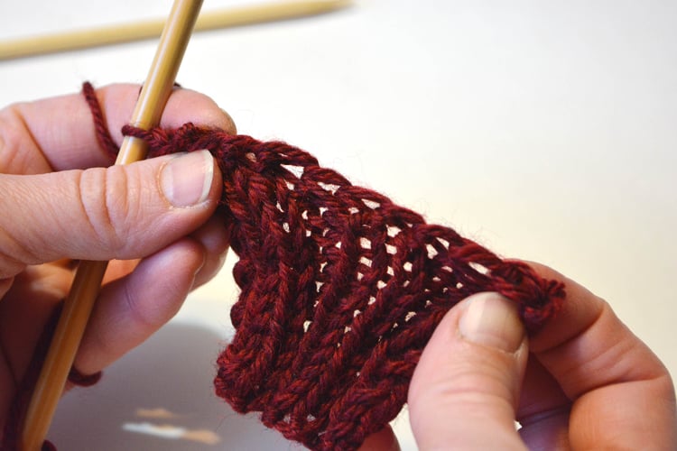 A stretched ribbed swatch bound off.